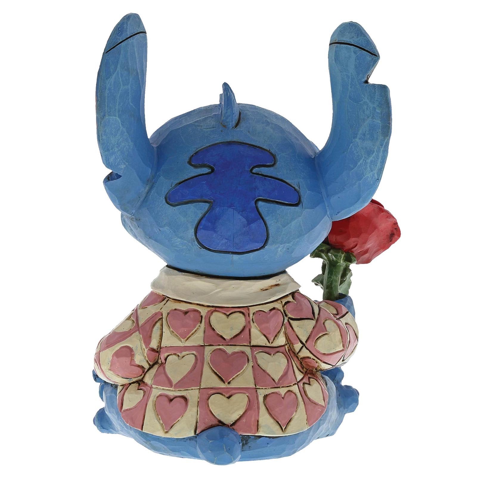 Speels Disney-beeldje van Stitch met bloemenboeket, in romantische en humoristische setting, perfect als cadeau of verzamelobject.
