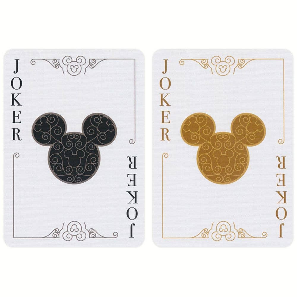 Close-up van kaart met goudfolie en Mickey Mouse detail.