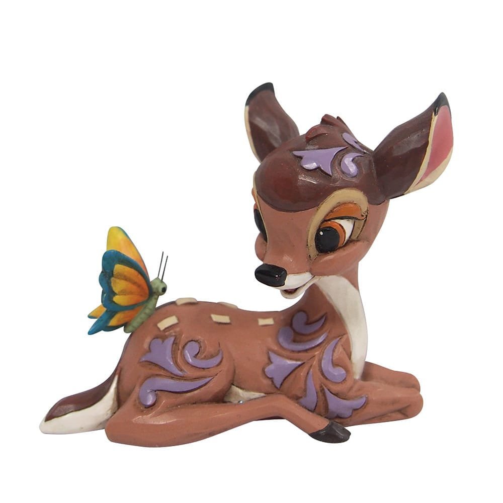 Bambi-miniatuur van Jim Shore met rosemalingdetails, vredig zittend met een vlinder.