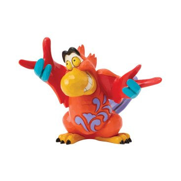 De Disney Traditions Iago Mini toont de ondeugende papegaai uit Aladdin in een speels en gedetailleerd mini-beeldje. Perfect als decoratie, verzamelobject of origineel cadeau voor Disney-fans.