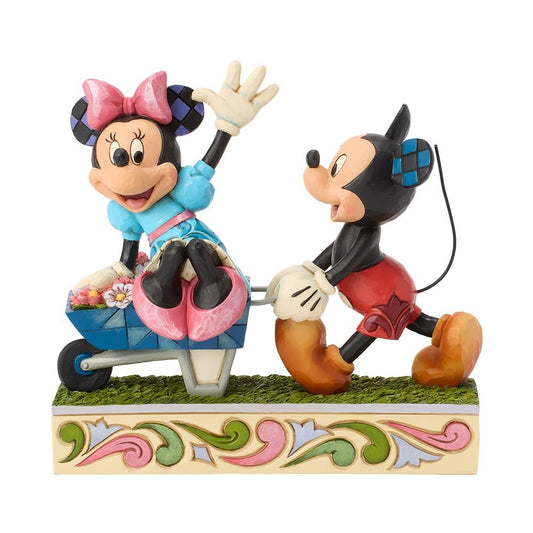 Disney Traditions Mickey en Minnie Mouse in kruiwagen beeld van Jim Shore met handgeschilderde folk-art details.