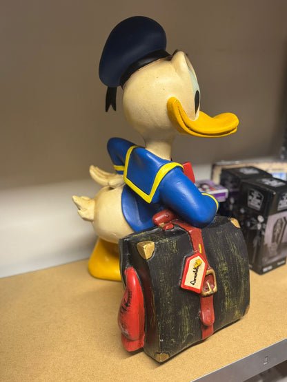 Vintage Disney beeld Donald Duck op reis met koffer
