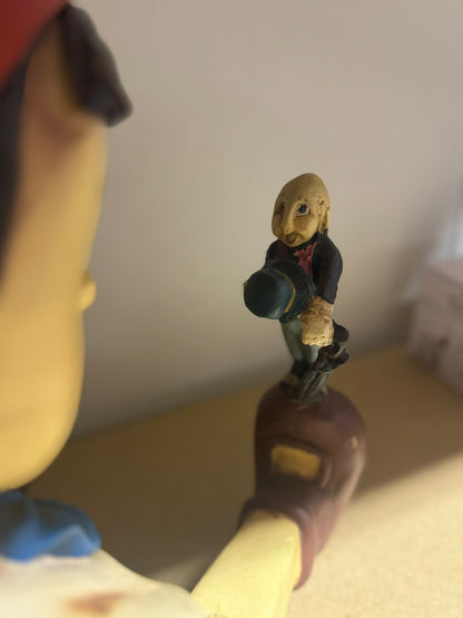 Pinokkio zittend met Japie Krekel Disney figurine