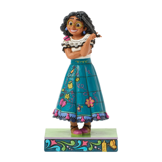 Haal de warme en kleurrijke wereld van Disney’s Encanto in huis met dit schitterende Disney Traditions Mirabel figuur. In de iconische Jim Shore-stijl is Mirabel prachtig uitgewerkt met rijke kleuren, unieke folkloristische details en een ambachtelijke uitstraling. Een bijzonder figuur dat direct de aandacht trekt en perfect past in elke Disney- of Encanto-collectie.