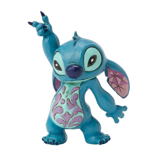 Jim Shore beeldje van Stitch die speels danst met rosemaling op zijn buik en kleurrijke patronen op zijn oren, vol charme en ondeugendheid.